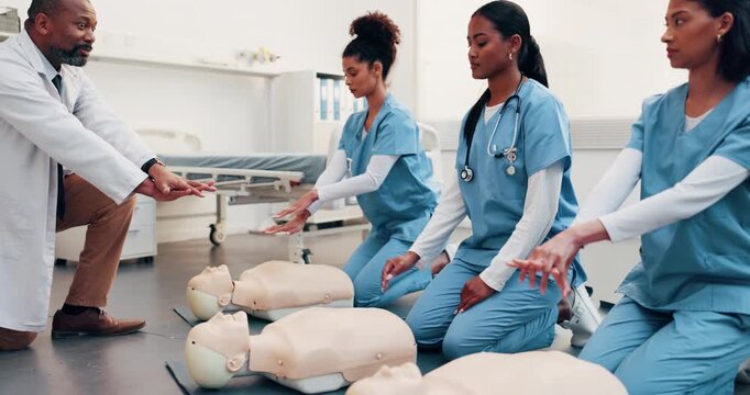 Cpr, teaching and doctor with demonstration for nurse team, compression technique or first aid. Healthcare, class and man with people, dummy and learning for medical support, rescue or cardiac arrest