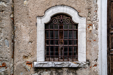 Obraz premium Arched Window with Decorative Iron Grille