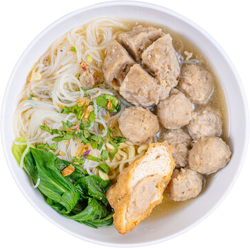 Top view bowl of indonesian bakso meatball soup with noodles tofu vegetables isolated on transparent background