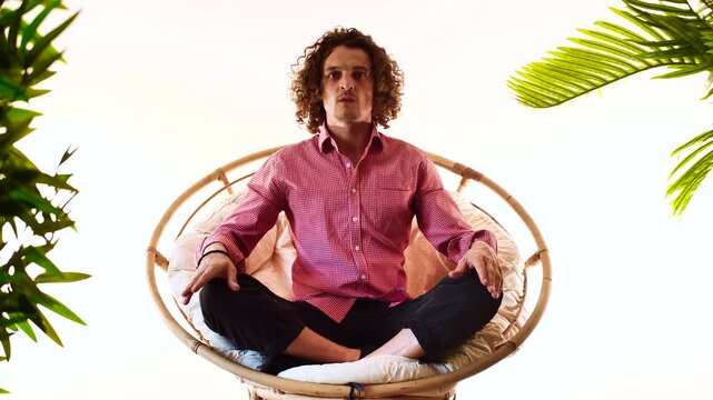 Man Meditating in Peaceful Infinite Space with Green Plants