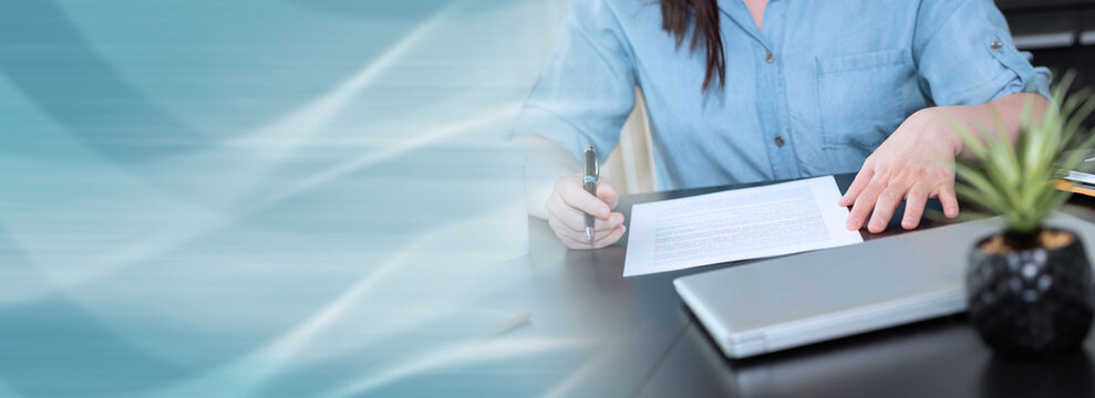 Businesswoman checking document; panoramic banner