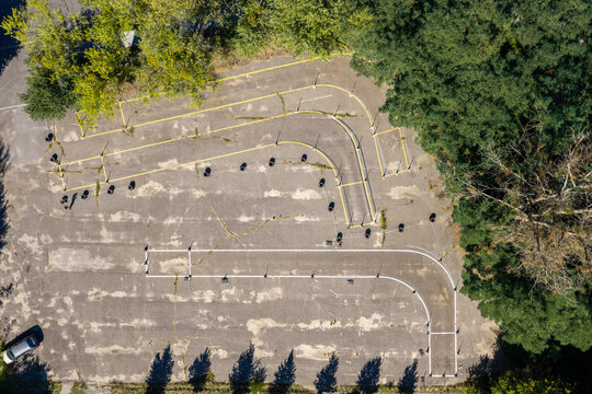 Driving school course with road markings and cones for learning car control