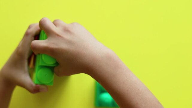 Join in the fun as this young builder assembles a construction kit with determination. The video highlights the intersection of play, engineering thinking, and the growth of fine motor skills.