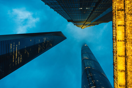 Modern skyscrapers and festive lights in the Lujiazui financial district of Shanghai at dusk