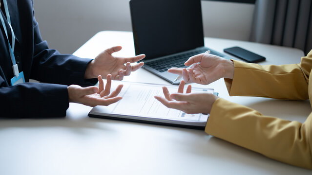 Business people hold a resume and talk to job applicants for job interviews about careers and Their personal history in the company. Recruitment concepts