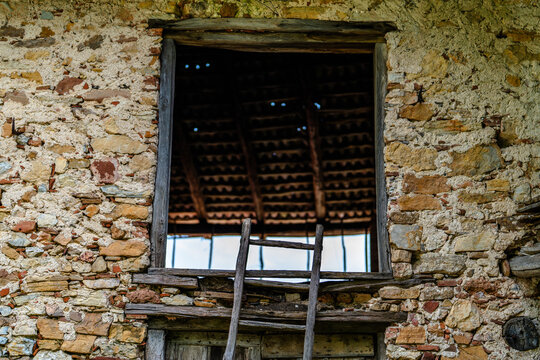 Open Window in Rustic Stone Building Wall