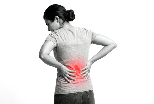 Woman Experiencing Lower Back Pain with Red Highlighted Spot