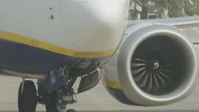 Fast Rotating Turbine on Large Airplane with Wing and Landing Gear Wheels with Front Nose.