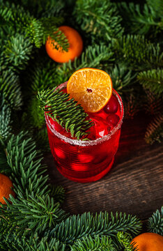 Tasty christmas cocktail with cranberry and mandarins. Shallow depth of field. Selective focus.