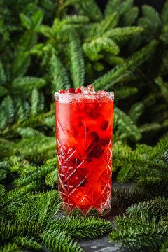 Tasty christmas cocktail with cranberry and foxberry. Shallow depth of field. Selective focus.