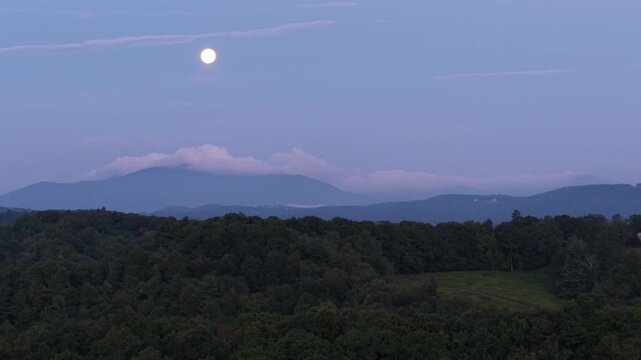 aerial moon push in over the appalachian mountains with grandfather mountain north carolina in the background
