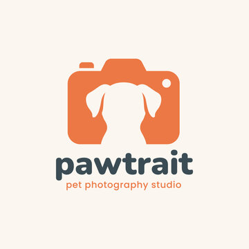 Modern orange camera logo with a dog silhouette in negative space. Includes text pawtrait pet photography studio. Great for animal photographers and branding.