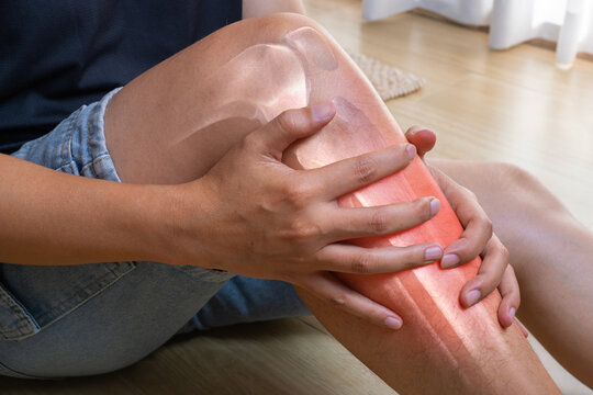 Shin pain shown with a medical anatomy overlay highlighting the lower leg and surrounding tissues. The image represents injury inflammation and specialized orthopedic treatment.