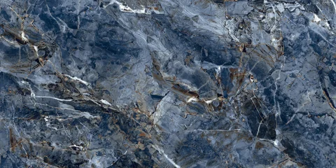 Elegant blue marble texture with soft natural veins and warm earthy tones, perfect for luxury interiors, ceramic tiles, and decorative backgrounds.   © Vidal