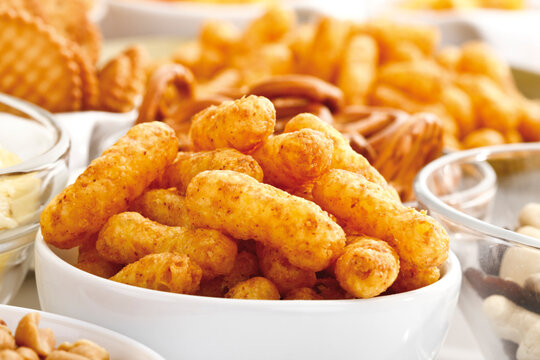 Assorted snacks, Peanut puffs in bowl, close-up