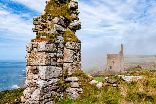 The ruined Botallack Mine overlooks the foggy sea in Cornwall