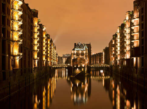 Germany, Hamburg, View of Speicherstadt with Elbe River at night