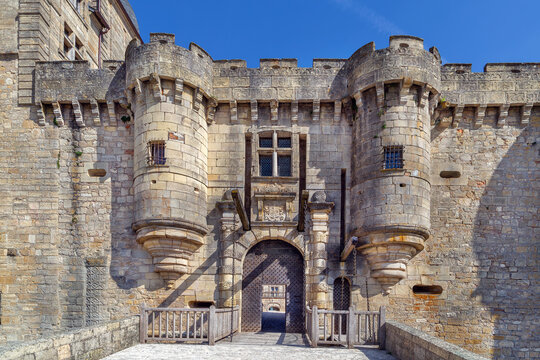 Entrance gate to Chateau de Hautefort, France, close up view. Classical stone and iron architecture under daylight