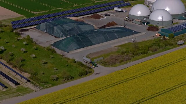 Aerial Video of Biogas Plant, Tractor and Solar Panels in Farmland