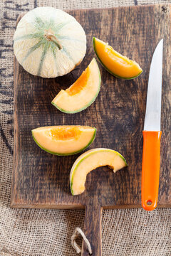 Whole and sliced Charentais melon