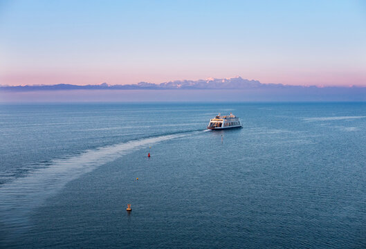 Ferry on Lake Constance in the morning, Mountains Altmann and Saentis in Switzerland in the background