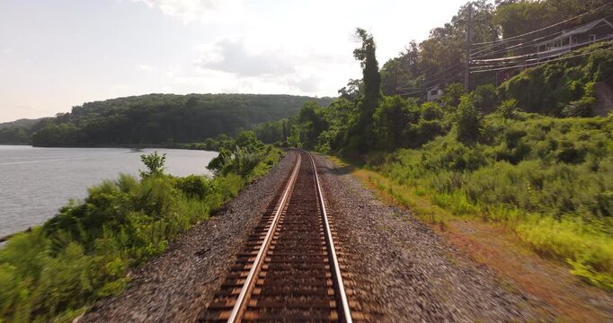 Down curving train tracks along the Hudson River in New York