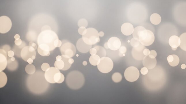 Warm ivory bokeh lights creating a soft, glowing background with a gentle, diffused effect for various creative applications