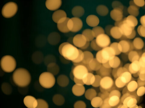 Champagne Gold and Emerald Bokeh Lights on Dark Luxury Abstract Background