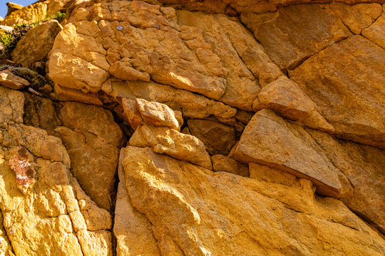 A beautiful orange rock pattern close-up. A summer landscape of a protected nature reserve Kallskaret in World Heritage Area in Western Norway.