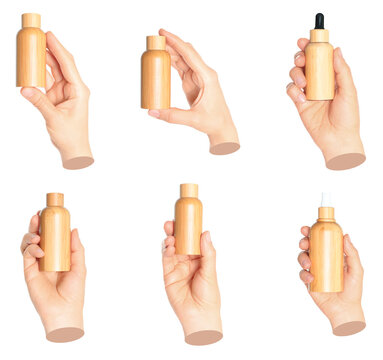 Set of Woman hand holds bamboo cosmetics bottle, isolated on transparent background, natural and eco cosmetics concept. Contemporary art design
