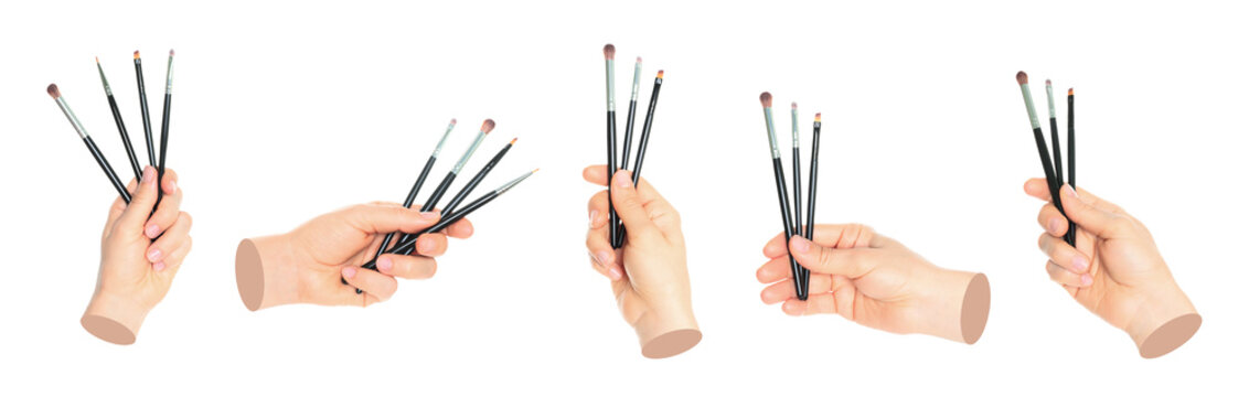Set of Woman hand holds cosmetics brushes, isolated on transparent background, cosmetics and visage concept. Contemporary art design