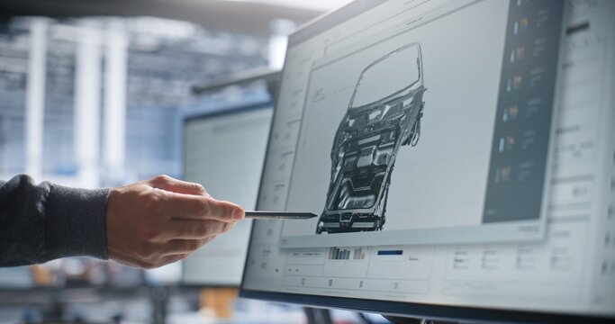 Specialist Pointing Stylus at 3D Car Body CAD Model on Computer Screen. Computer Aided Engineering and Digital Twin Software Optimize Automotive Design. Digital Twin Technology and Vehicle Design.