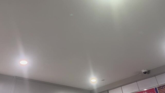 Modern Interior Ceiling with Recessed LED Lights and CCTV Camera