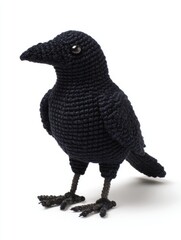 Obraz premium Crochet Black Crow Amigurumi Figurine Isolated On A White Background
