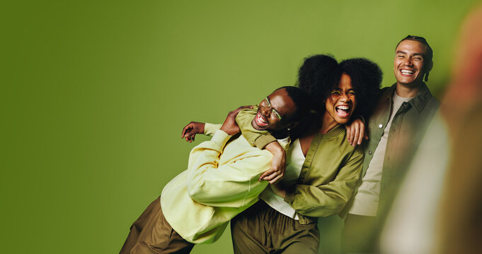 Friends share happy movement and laughter together in the studio