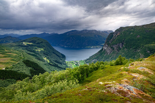 A beatiful landscape with a marked hiking trail leading up the mountain. A summer scenery of Torvloysa mountain in the World Heritage area in Western Norway.