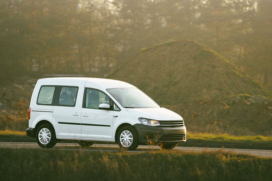 Passenger minivan on busy asphalt road