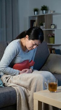 Bladder inflammation disorder: cystitis condition, urethra irritation, pelvic discomfort, abdomen cramp, suffer distress, woman hold, warm compress, night relief, sick female, manage symptom.