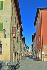 Obraz premium San Quirico d'Orcia, ancient houses and streets of the old village, Siena, Val d'Orcia, Tuscany, Italy