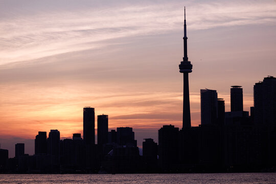 Toronto skyline with CN Tower and waterfront on Lake Ontario at sunset, Ontario, Canada. g.