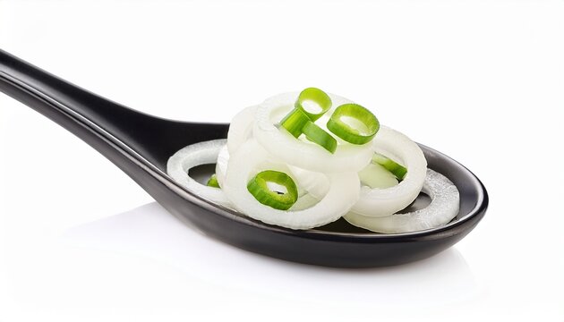 Sliced Spring Onions On A Black Spoon On A White Background