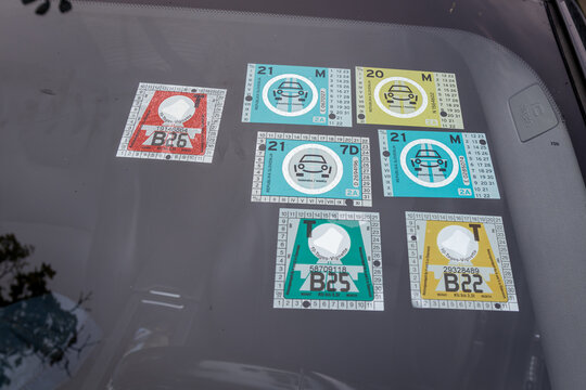 Jesenice, Slovenia July 17, 2026 collection of road toll and vignette stickers displayed on a vehicle windshield for highway travel access.