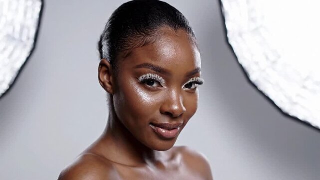 Radiant female model posing studio photoshoot showcasing natural skincare cosmetics product