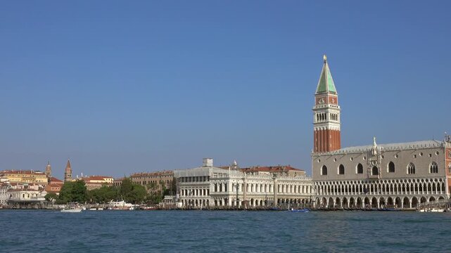 View of St. Mark's Campanile and Doge's Palace along the waterfront in Venice, Veneto, Italy.