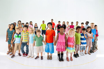 Fototapeta premium Diverse children standing together joyfully