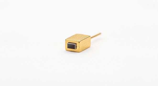 Fiber laser pump diode pin and semiconductor facet. Gold-plated copper alloy terminal block for industrial laser excitation and high-power photonics. Isolated on white background.