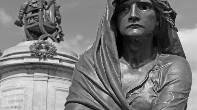 black and white "Film noir " style image of a  statue of Lady Macbeth in Stratford upon Avon , Warwickshire, UK .Lady Macbeth is a leading character in William Shakespeare's tragedy Macbeth