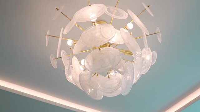 Luxurious and contemporary chandelier with delicate glass elements hanging from the ceiling, illuminating a room with warm, sophisticated light for an elegant interior design aesthetic