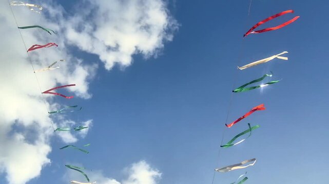 Colorful Kites Flying Against Blue Sky.