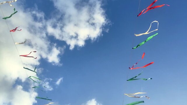 Colorful Kites Flying Against Blue Sky.
